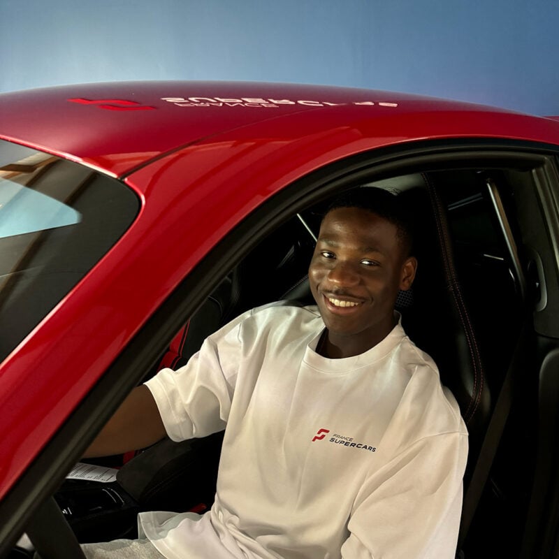 Florian Smeralda sitting in the driver's seat of a car
