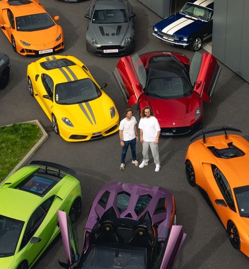 Luxury sports cars parked outside the France Supercars showroom in Rennes
